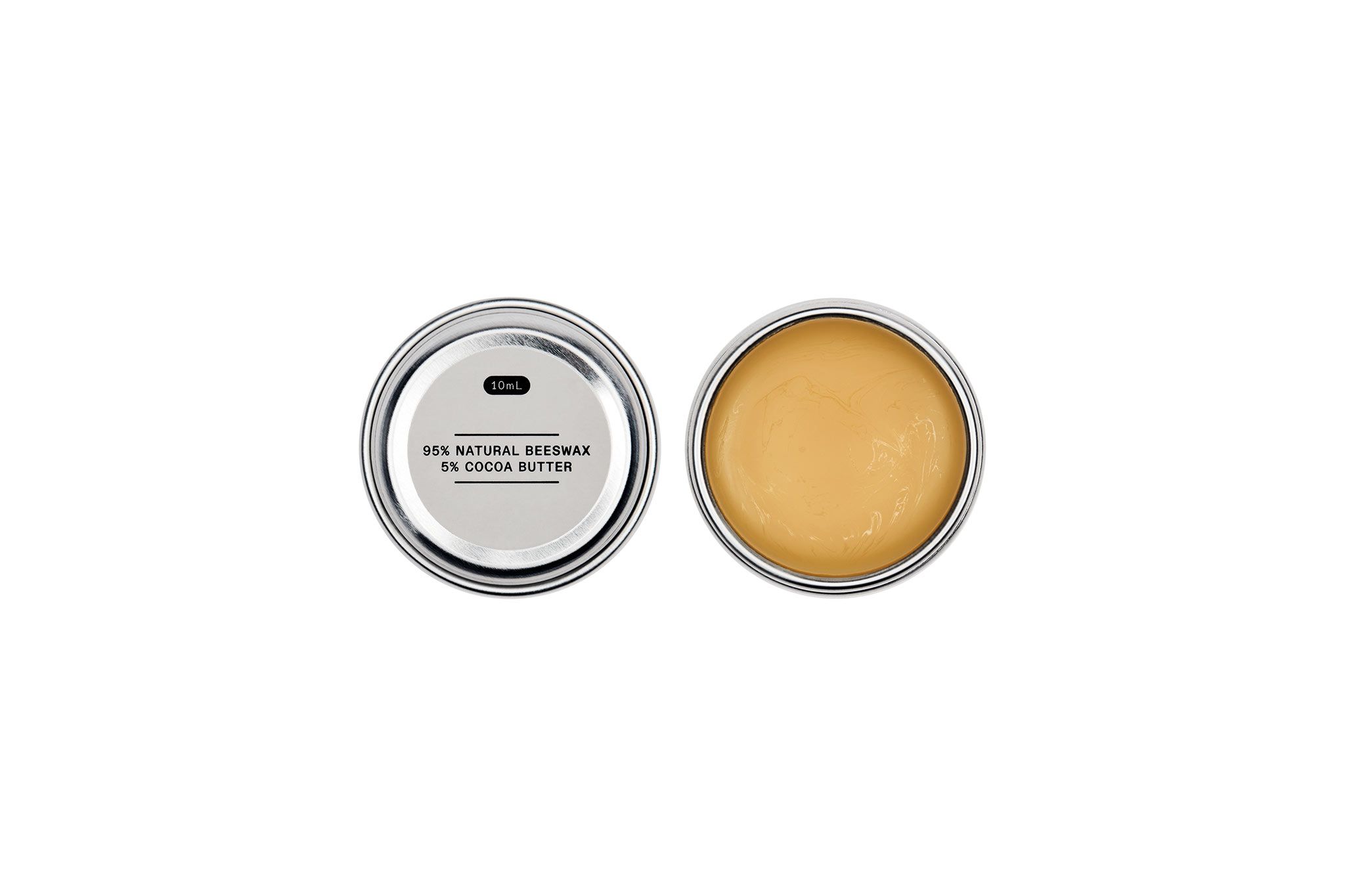 An open tin of leather balm
